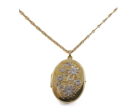 A 9ct gold floral locket pendant, the oval locket with incised floral detail faced, 46mm x 28mm, Birmingham 1990, suspended b