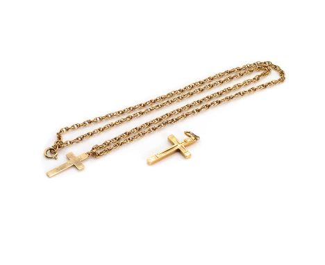 Two 9ct gold cross pendants and a chain, the first incised and textured, 27mm x 15mm, London 1988, the second plain, 22mm x 1
