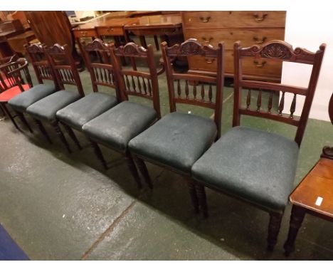 Set of six late 19th century American walnut dining chairs with carved and bobbin railed backs, blue over-stuffed seats (6) 