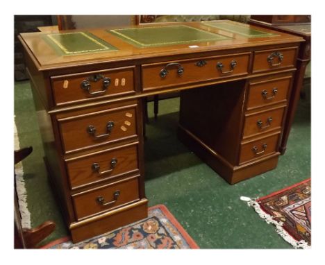 20th century reproduction oak 9-drawer kneehole desk with metal swan neck handles, three panel tooled green leather inset top