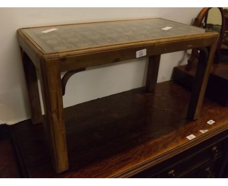 Pine framed rectangular glass topped coffee table with open work panel top, raised on square legs, with corner supports, 27in