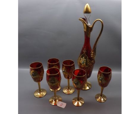Set of six red Murano glass goblets with raised floral leaf with matching decanter and stopper with twisted gilded handle, de