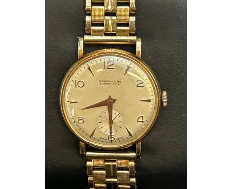 9ct Gold case winegartens London E.C2 vintage wristwatch, sub second dial at 6 o clock, rolled gold strap. Manual wind, curre