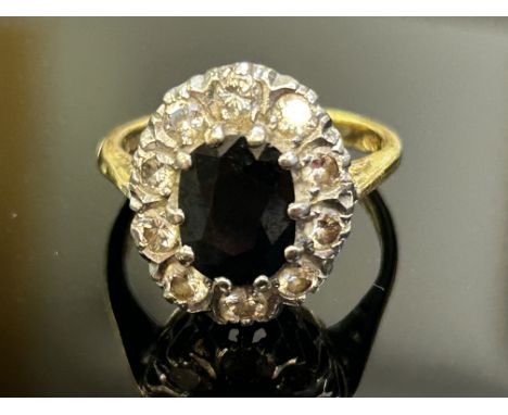 18ct Gold ring set with sapphire & 10 diamonds Size M.5g Weight 6.7g 