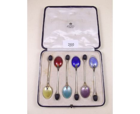 A set of six Aspreys silver gilt and enamel coffee spoons in fitted case - Birmingham 1928