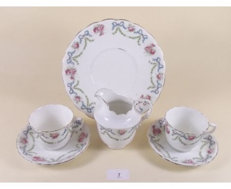 A Bridgwood tea service comprising: six cups and saucers, six tea plates, cake plate and jug