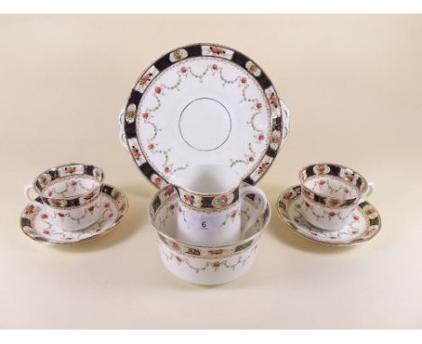 An Edwardian Melba tea service comprising: six cups and saucers, milk, sugar, six tea plates and cake plate