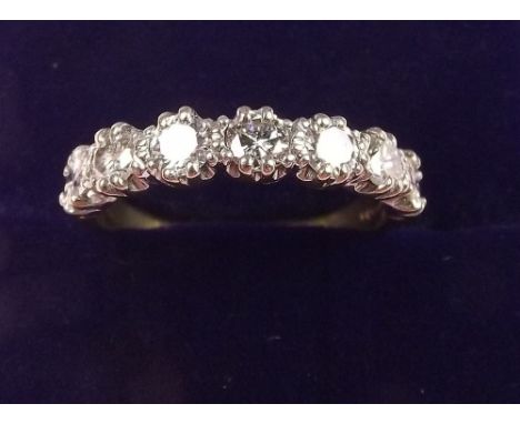 An 18 carat gold seven stone diamond ring - size O