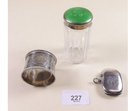 A silver vesta case - Birmingham 1903, a cut glass toiletry jar with enamel lid - Birmingham 1930 and a napkin ring 1882