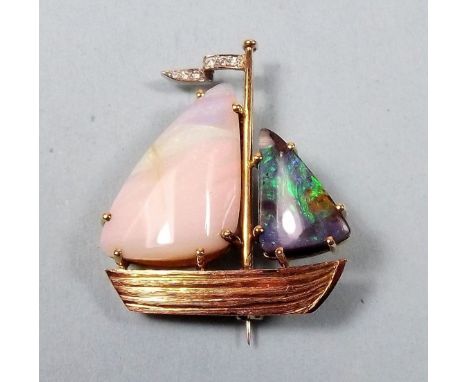 An unusual gold brooch in the form of a yacht with white and black opal sails and diamond set flag, 11.5g - 3.3 x 2.8cm