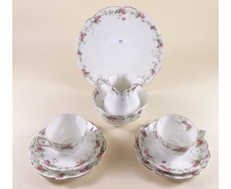 An Edwardian tea service printed roses comprising: milk, sugar, cake plate, six cups and saucers and six plates