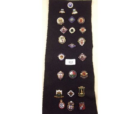 A collection of enamel bowling badges