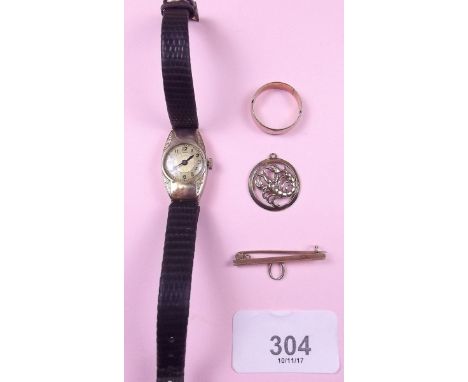 A 9 carat gold wedding ring, a gold Scorpio pendant and bar brooch 6.7g total, plus a gold ladies wrist watch