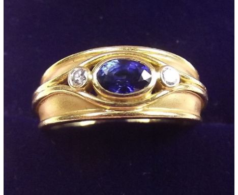 An 18 carat sapphire and diamond ring - size N, 5.7g