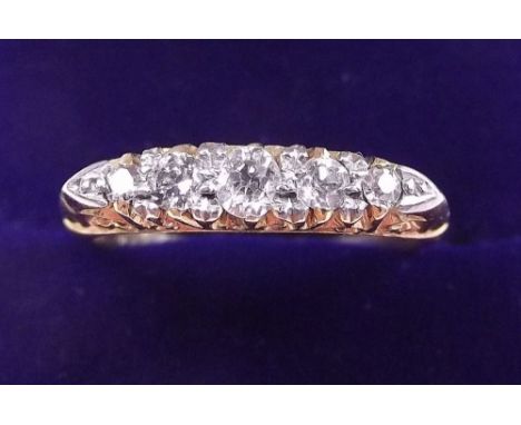 An 18 carat gold five stone diamond ring - size R