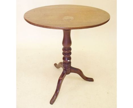 A 19th century mahogany oval topped wine table on turned column and tripod base