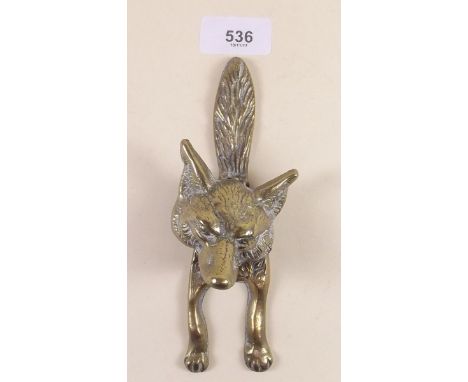 A  brass fox door knocker