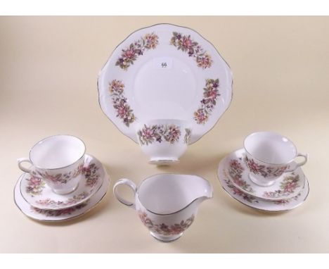 A Colclough tea service printed flowers comprising: six cups and saucers, cake plate, milk, sugar and six tea plates