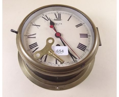 A Smiths eight day brass cased Naval ships clock with arrow mark, with key