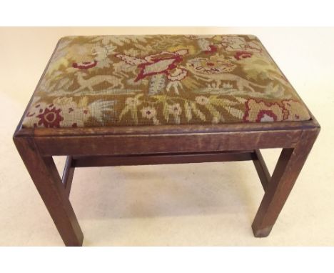 A Georgian mahogany stool with drop in tapestry seat on square supports