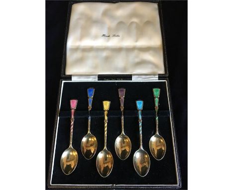 A Boxed set of silver and enamel teaspoons, Harrods.