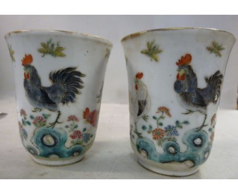 A pair of late 19thC Chinese porcelain footed beakers with flared rims, decorated in turquoise on the interior and cockerels 