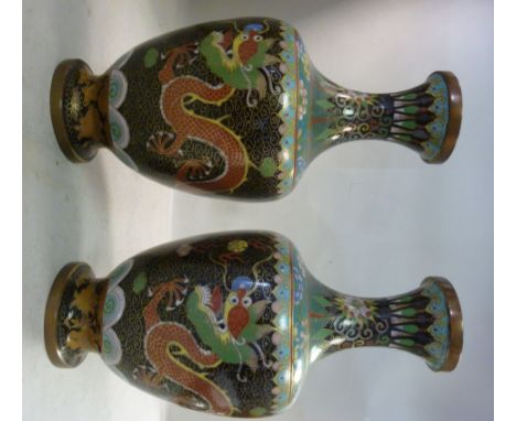 A pair of early 20thC Japanese cloisonne shouldered, ovoid shaped vases, having narrow necks and flared, cup rims, decorated 