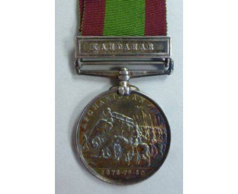 An Afghanistan medal, 1878-79-80, Queen Victoria's portrait verso, Kandahar on the bar, inscribed 1050 Pte.W Allen 66th Foot