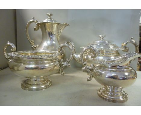 A William IV Scottish three piece silver tea set  comprising a teapot of squat, bulbous form with decoratively foliate, shell