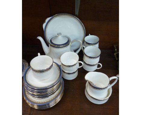 A Royal Albert Paragon Sandringham tea set, comprising teapot, sandwich plate, seven cups, saucers and side plates, cream and