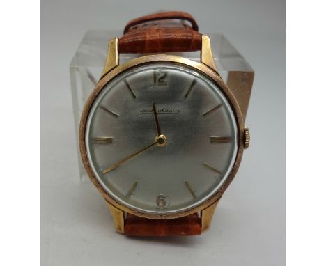 A gentleman's gold plated Jaeger-LeCoultre wristwatch on a leather strap