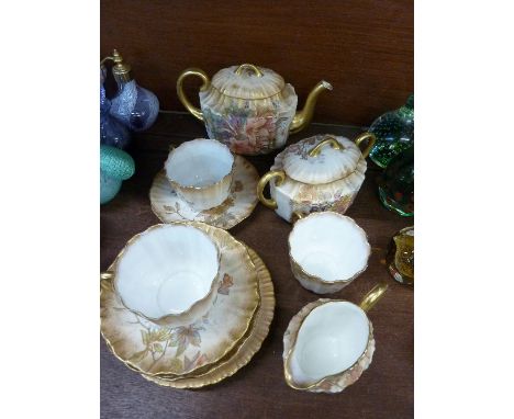 A Doulton Burslem teaset, comprising teapot, sugar, cream, three cups, four saucers and four plates