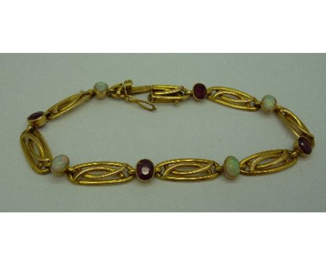 A 15ct gold, opal and ruby Art Nouveau bracelet, weight 9g