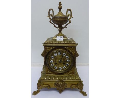 A brass cased mantel clock with striking movement, height 40cm