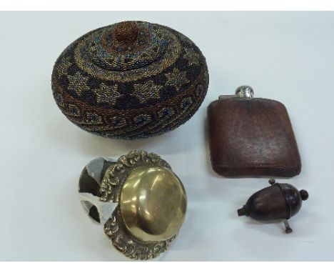 A brass bell, a treen switch, a hip flask and a bead lidded pot