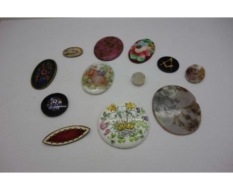 A collection of unmounted ceramic and enamelled plaques, etc.
