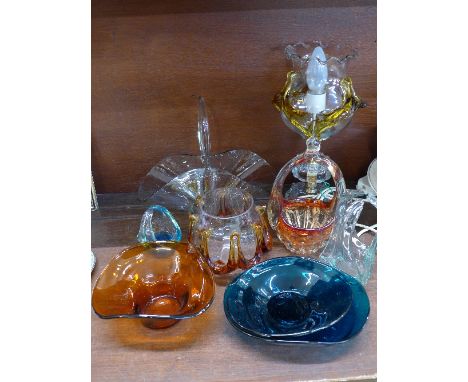 A glass table lamp, a lamp shade and other coloured glass