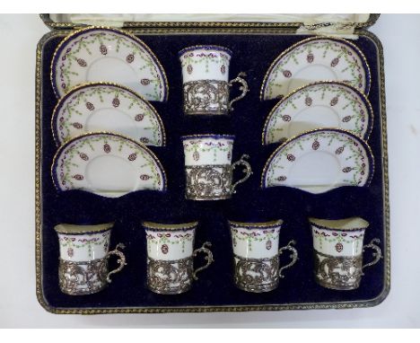 Six Royal Worcester coffee cups and saucers with silver cup holders, Birmingham 1905 to 1909, a/f