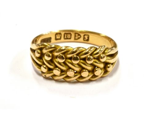 A GENT'S 18CT YELLOW GOLD KEEPER RING  The interwoven front to hallmarked 18ct yellow gold shank, size P ½, weighing approx. 