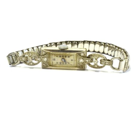 TWO LADIES VINTAGE WATCHES  Comprising a platinum cocktail watch set with very small diamonds to lugs on a white metal expand