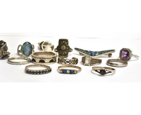 TWELVE ASSORTED SILVER RINGS  together with a silver rough opal set brooch and a silver pendant with cultured pearl in water.