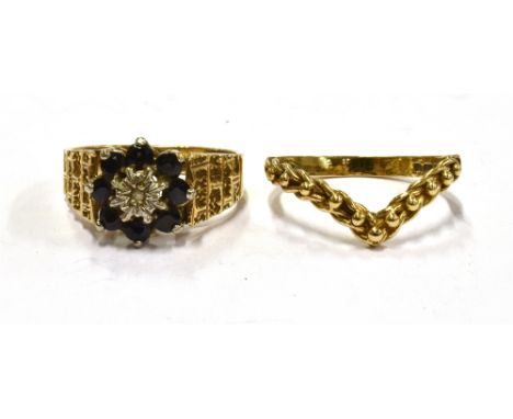 TWO 9CT GOLD DRESS RINGS Comprising a small diamond and sapphire illusion set cluster ring; and a plain wishbone, total gross