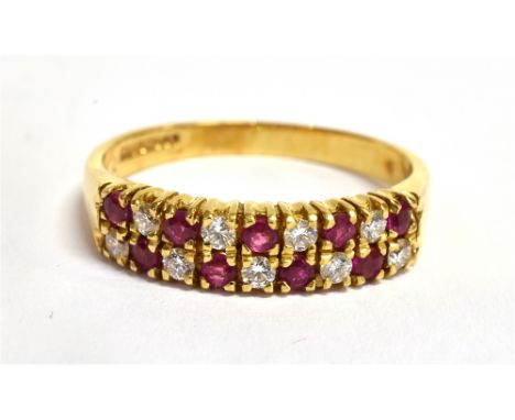 A RUBY AND DIAMOND TWO ROW 18CT GOLD HALF ETERNITY RING The front section comprising two rows of alternating small rubies and