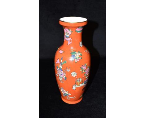 A CHINESE REPUBLIC PERIOD VASE  decorated with scholars objects on a red ground, seal type mark to base, 26cm high Condition 