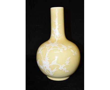 A CHINESE PORCELAIN VASE  with pate sur pate style decoration depicting two birds in a blossoming tree on a yellow ground, bl