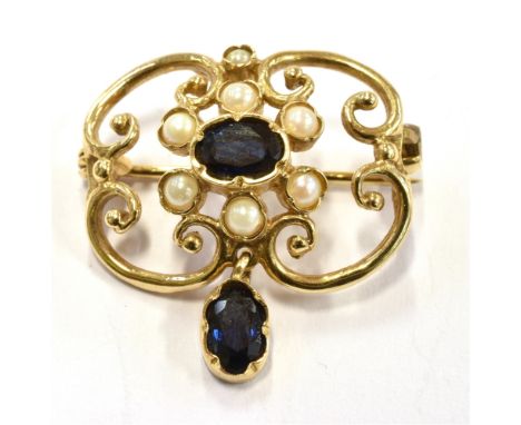 A MODERN SAPPHIRE AND CULTURED PEARL 9CT GOLD PENDANT BROOCH  The open scroll design of quatrefoil shape with blue sapphire c