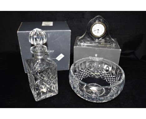 WATERFORD CRYSTAL:  a decanter and stopper and bowl, both boxed, and a mantle clock with quartz movement Condition Report : a