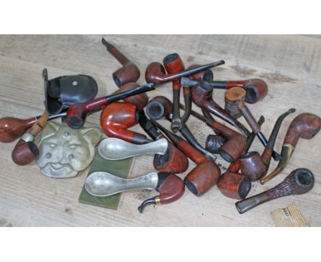 A box of vintage pipes and accessories.  
