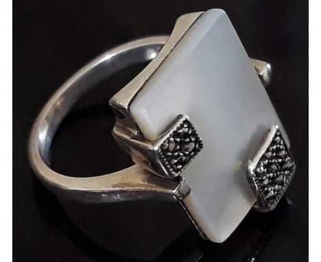 A contemporary Art Deco style silver and mother of pearl ring, size K, gross weight 5.3g.  