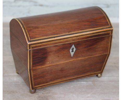 A Georgian domed top box wood strung mahogany tea caddy with brass ball feet, length 18.5cm.  